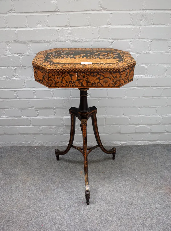 A Regency lift top penwork decorated occasional table, of compressed octagonal form on open tripod base, 48cm wide x 81cm high.