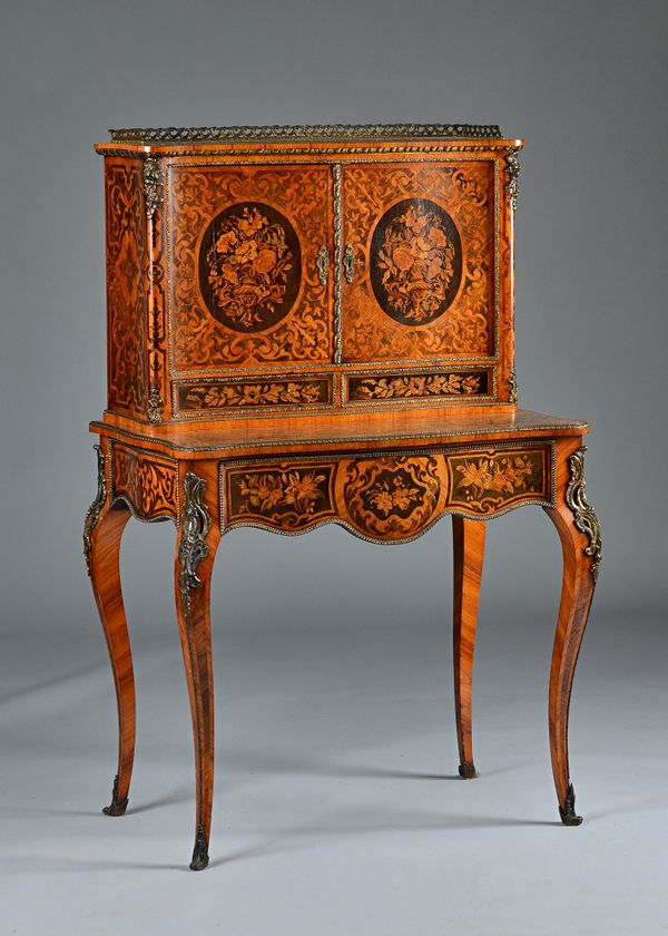 A 19th century French gilt metal mounted floral marquetry inlaid bureau de dame,  with a pair of serpentine doors over drawers on cabriole supports, 8