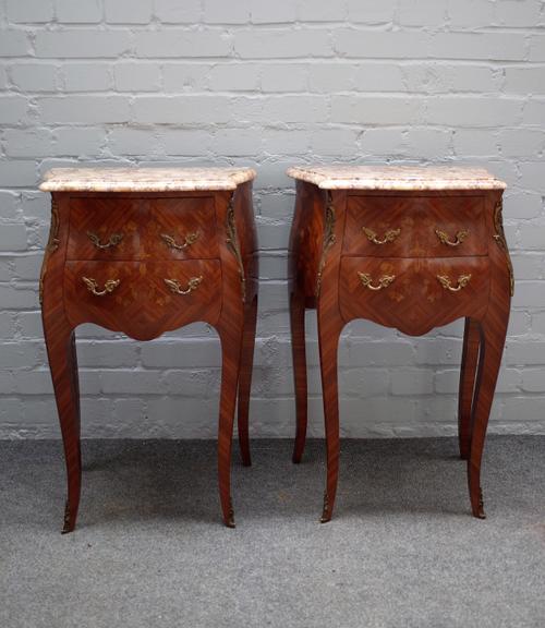 A pair of Louis XV style floral marquetry inlaid kingwood marble top bedside tables, each with bombe three drawer base on cabriole supports, 48cm wide