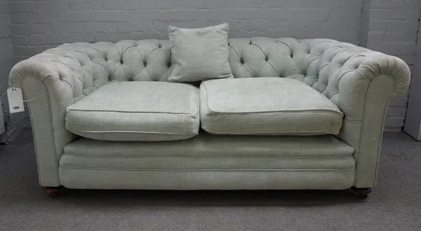 An early 20th century pale teal button back Chesterfield sofa, on bun feet, 190cm wide x 75cm high.