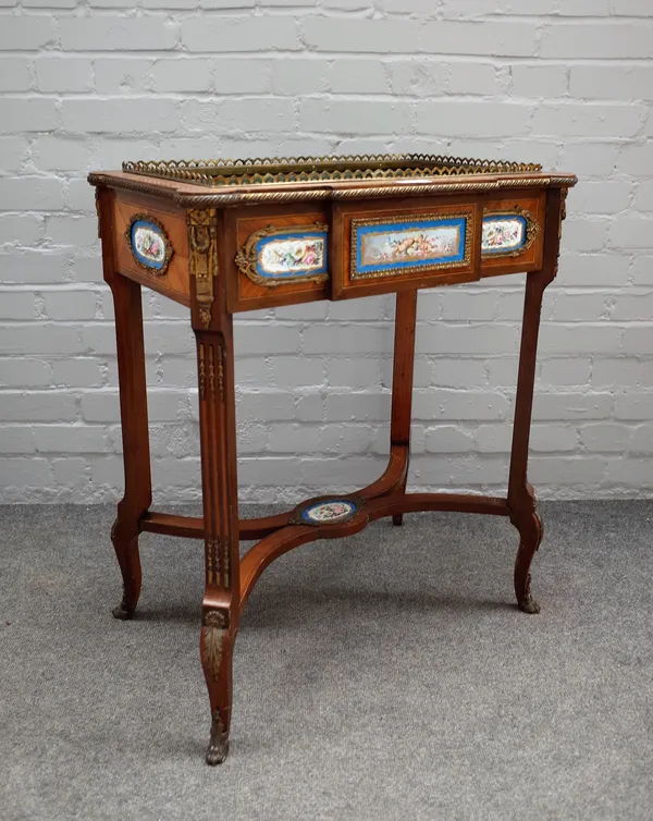 A late 19th century gilt metal and ceramic mounted Kingwood rectangular jardiniere, on tapering square supports united by 'X' frame stretcher, 66cm wi