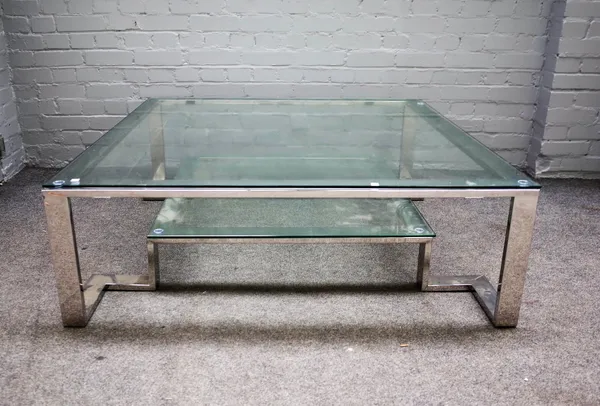 A 20th century square polished steel and glass two tier coffee table, 121cm wide x 41cm high.