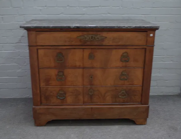 An early 19th century French commode, the marble top over one long drawer and pair of cupboards fronted as three long drawers 115cm wide x 94cm high.