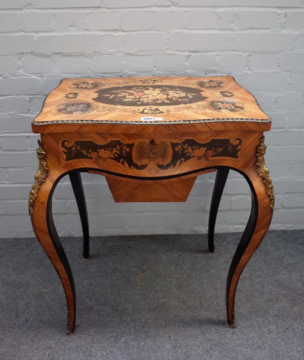 A late 19th century French lift top work table, of serpentine outline, on cabriole supports, 65cm wide x 76cm high.