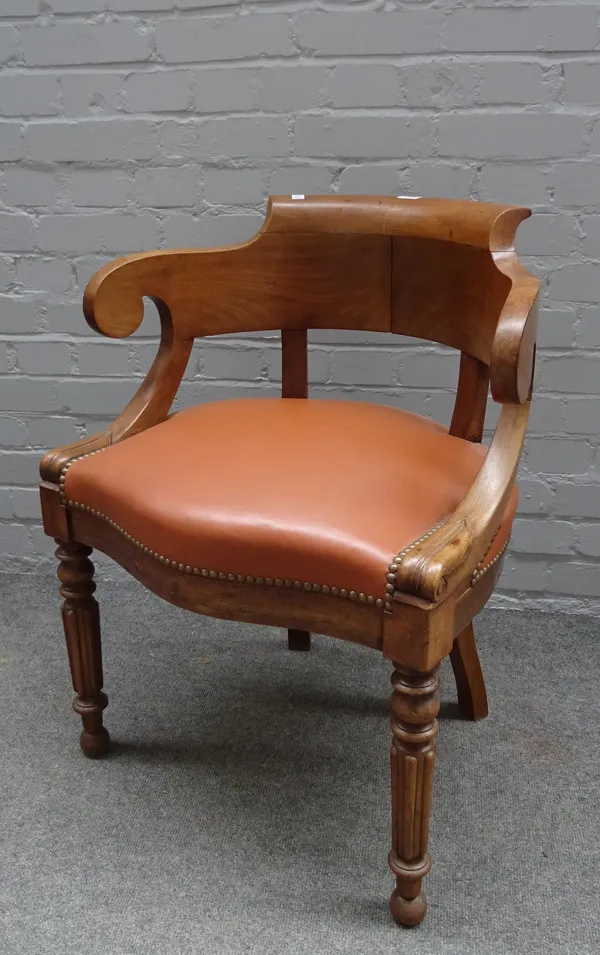 A 19th century French walnut tub back desk chair on reeded supports 63cm wide x 78cm high.