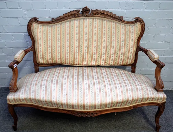 A Louis XV style stained beech open arm sofa with serpentine seat on scroll supports, 125cm wide x 97cm high.