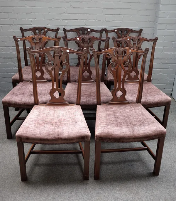 A set of twelve George III style mahogany dining chairs, each with pierced splat on canted square supports, to include a pair of carvers, (12).