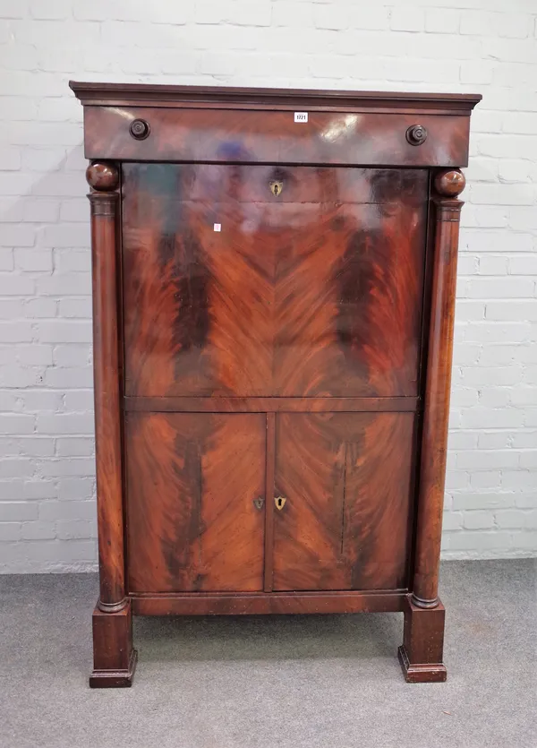 A 19th century Continental secretaire a abattant, the fall revealing a fitted interior over a pair of cupboards, flanked by turned columns, 98cm wide