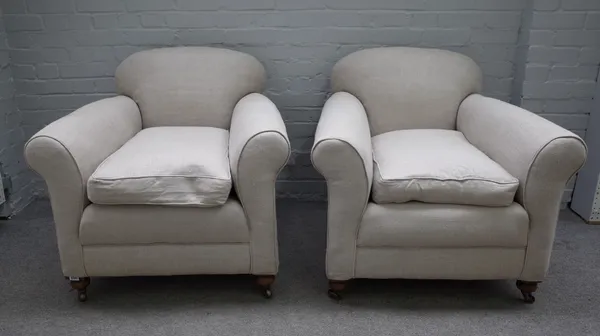 A pair of early 20th century easy armchairs on turned mahogany supports, 85cm wide x 81cm high (2).