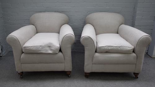 A pair of early 20th century easy armchairs on turned mahogany supports, 85cm wide x 81cm high (2).