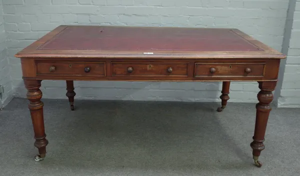 A William IV mahogany centre library table with six opposing frieze drawers on turned supports, 152cm wide x 76cm high.