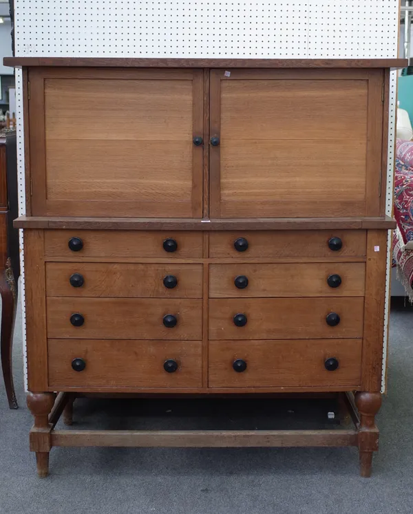 John Thorburn McGaw (1872-1952); a Sussex made Arts and Crafts oak side cabinet in the manner of Heals, made at St Leonard's Forest Horsham, with two