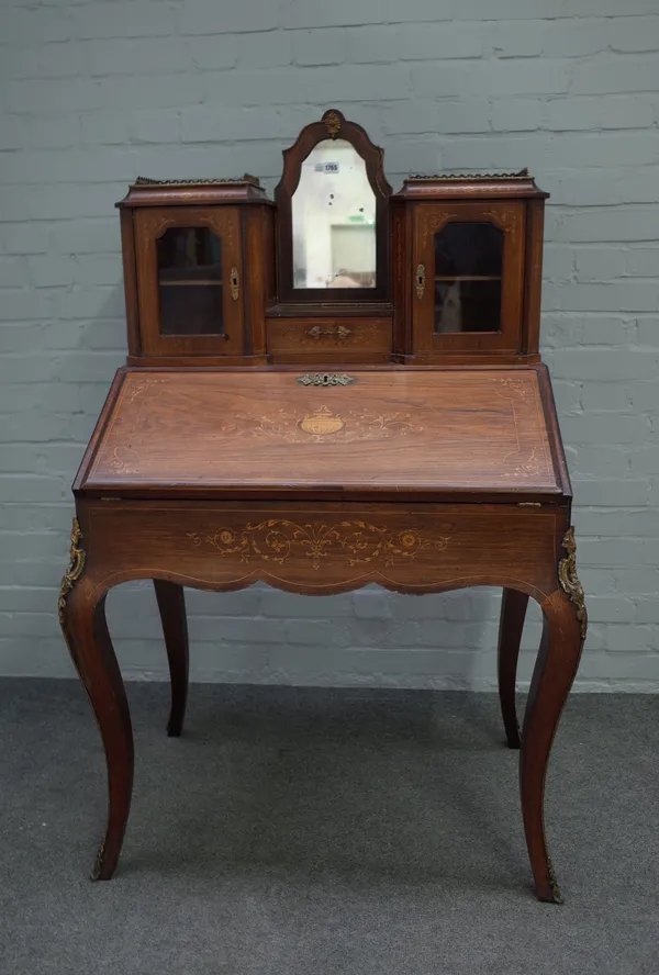 A Victorian inlaid rosewood Bonheur du Jour, with cupboard superstructure over fitted interior on gilt metal mounted cabriole supports, 88cm wide x 14