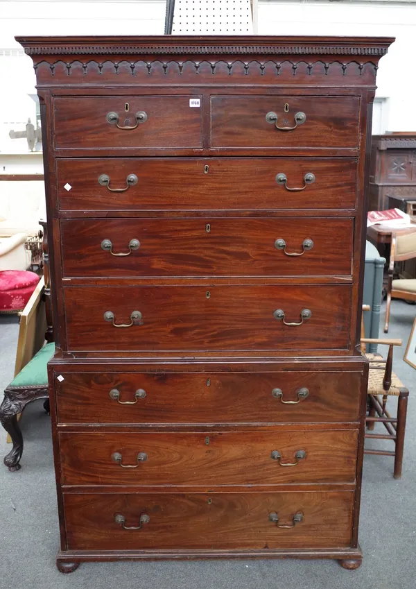 A George III mahogany chest on chest, of two short and six long graduated drawers, on bun feet, 112cm wide x 182cm high.