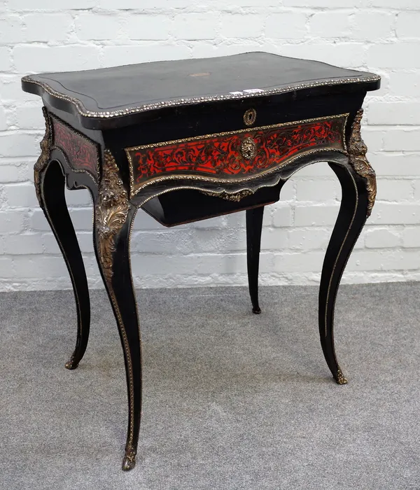 A 19th century gilt metal mounted ebonised boulle work lift top work table, with frieze drawer and wool box on cabriole supports, 61cm wide x 74cm hig