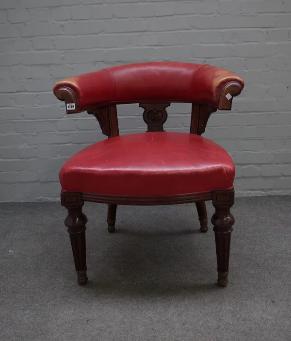 A Victorian red leather upholstered tub back office chair on fluted mahogany supports, 71cm wide x 85cm high.