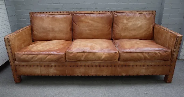 A mid-20th century three seater studded brown leather upholstered square back sofa, 203cm wide x 80cm high.