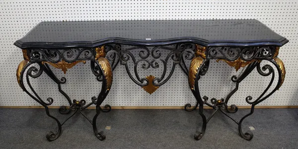 A 20th century French console table, the serpentine marble top over a polished steel and cast brass scroll base, 182cm wide x 89cm high,