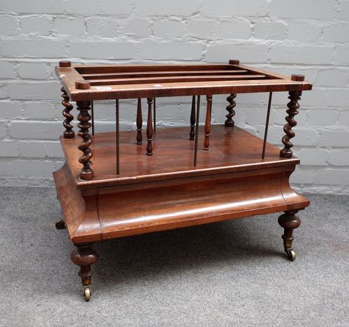 A Victorian rosewood three division Canterbury, with single drawer base on turned supports, 66cm wide x 53cm high.