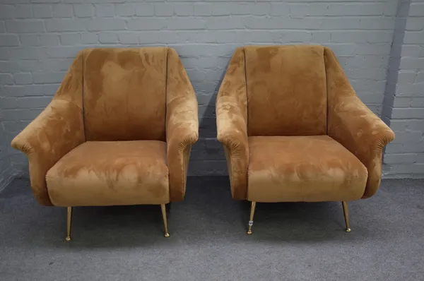 A pair of retro design gold upholstered armchairs, on turned lacquered brass supports, 84cm wide x 88cm high, (2).