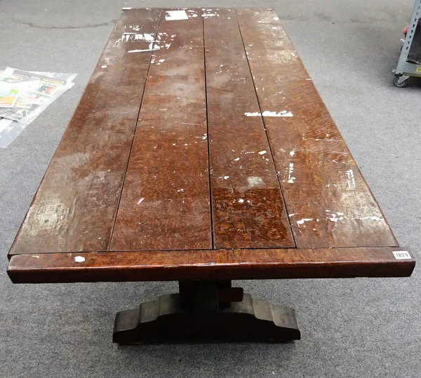 A 17th century style oak veneered plank top refectory table on trestle end standards, 84cm wide x 200cm long