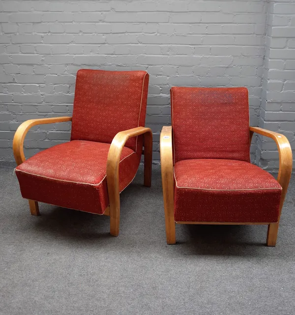 A pair of mid-20th century easy arm chairs on bentwood, ash and beech stands, 53cm wide x 89cm high (2).