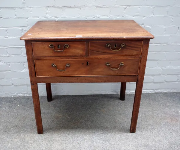 A George III mahogany lowboy of two short and one long drawer on canted square supports, 76cm wide x 73cm high.