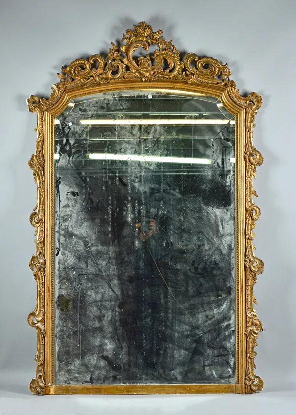 A 19th century gilt framed overmantel mirror with 'C' scroll crest and scroll moulded frame, 130cm wide x 200cm high. Illustrated.