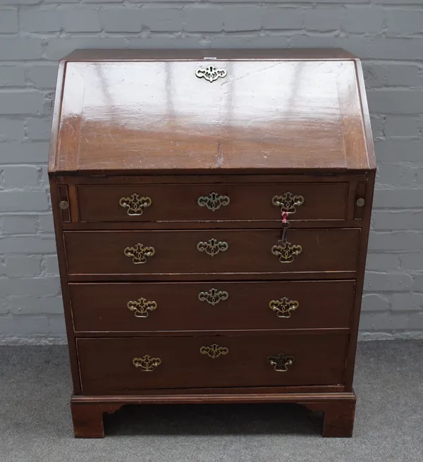 A George III mahogany bureau, the fitted interior over four long graduated drawers on bracket feet, 77cm wide x 102cm high.