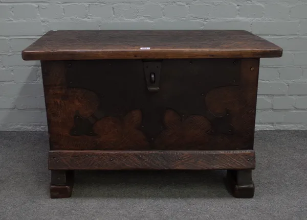 A 17th century Spanish style metal mounted oak coffer/ strong box of plank construction, 87cm wide x 57cm high.