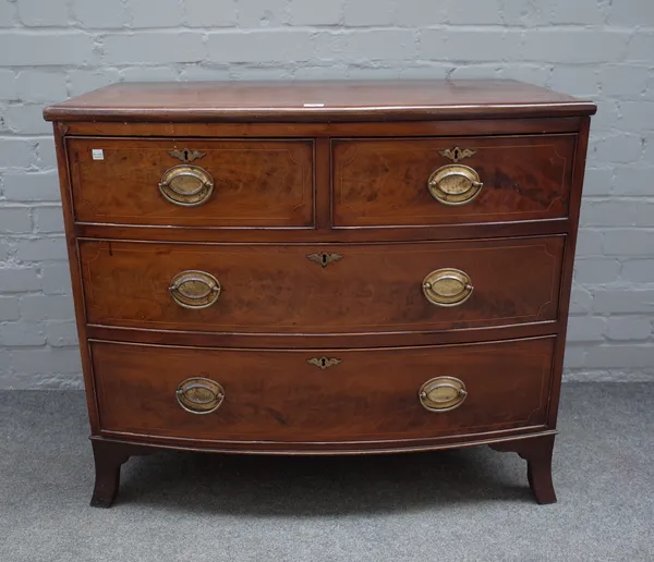 A Regency mahogany bowfront chest with two short and two long drawers on splayed feet, 90cm wide x 79cm high.