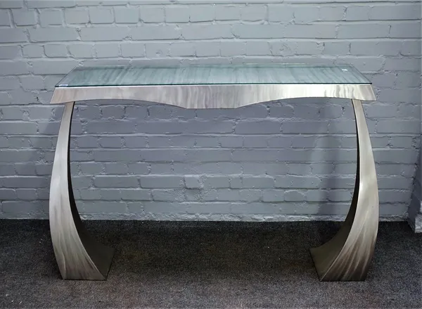 20th century design; a polished steel console table on shaped tapering square supports, 142cm wide x 92cm high.