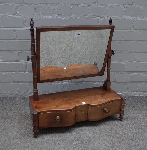 A William IV mahogany toilet mirror with brass mounted two drawer base on ring turned supports, 55cm wide x 61cm high.