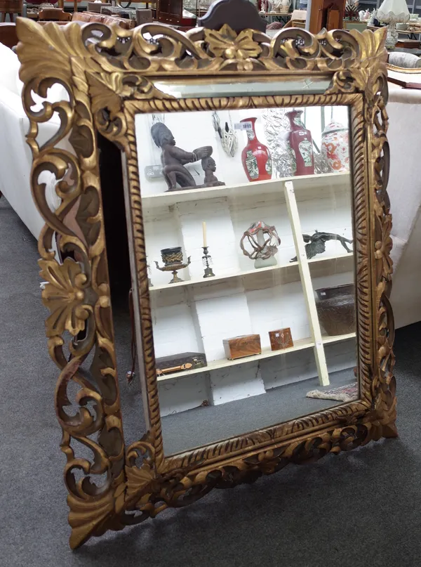 A late 19th century gilt framed wall mirror with acanthus carved swept marginal frame, 113cm wide x 137cm high.