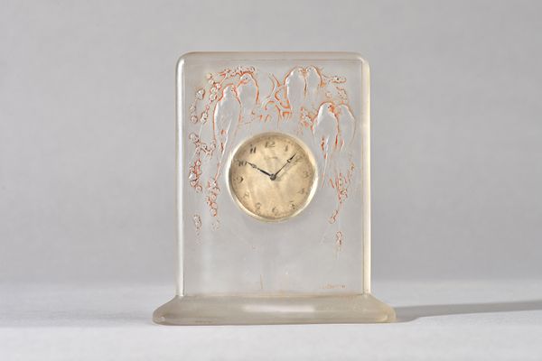 `Six Hirondelles Perchees', a Lalique glass clock, designed 1920, moulded in relief and sepia stained, etched mark, R Lalique France no.763, moulded L