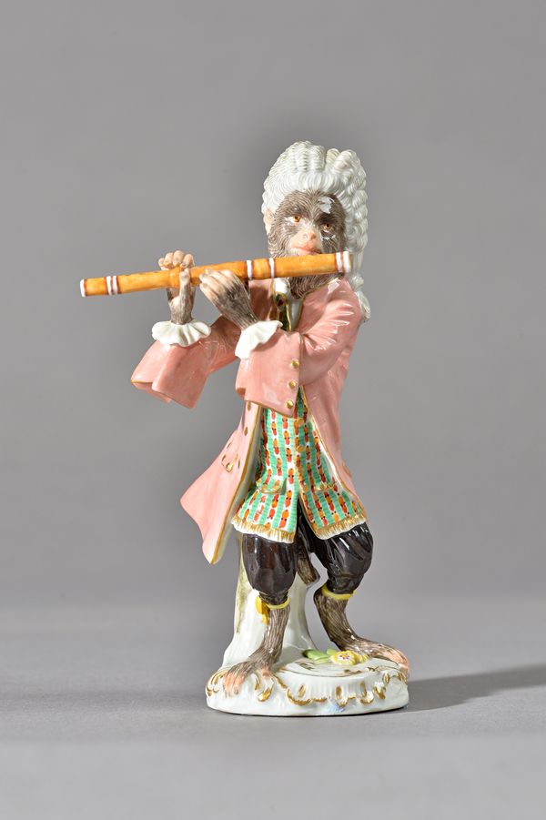 A Meissen monkey band figure of a flautist, 20th century, standing on scroll moulded base, blue crossed swords mark, impressed 118, 13.5cm. high. Illu