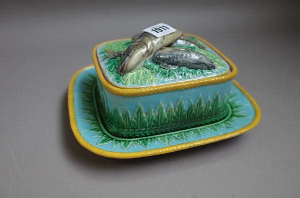 A George Jones majolica sardine box, cover and stand, circa 1870,the sides moulded with leaves against a turquoise ground, the cover with overlapping