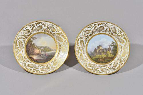 A pair of Barr, Flight & Barr, Worcester plates, circa 1810, painted with named views, Brinkburn Priory, Northumberland and Mount Edgecombe, Cornwall,