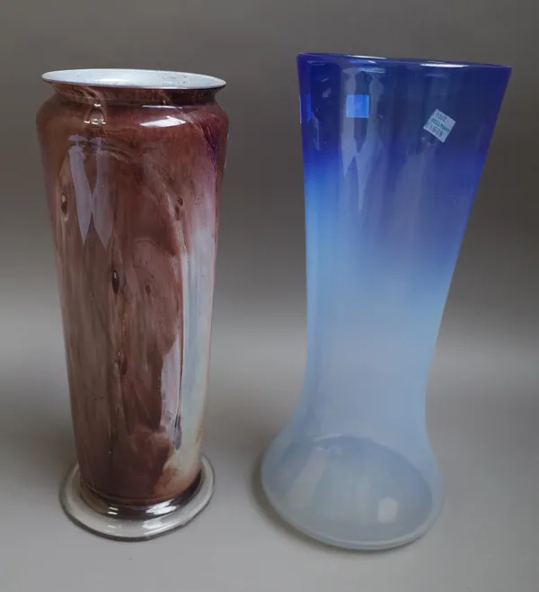 Two Graystan glass vases, circa 1930, one of cylindrical form streaked in brown and white, 28.5cm. high; the other of shaded blue tone, tapered cylind