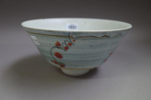 David Leach, a stoneware bowl, decorated with blossom against a blue banded ground, impressed DL mark to base, 20.3cm diameter.