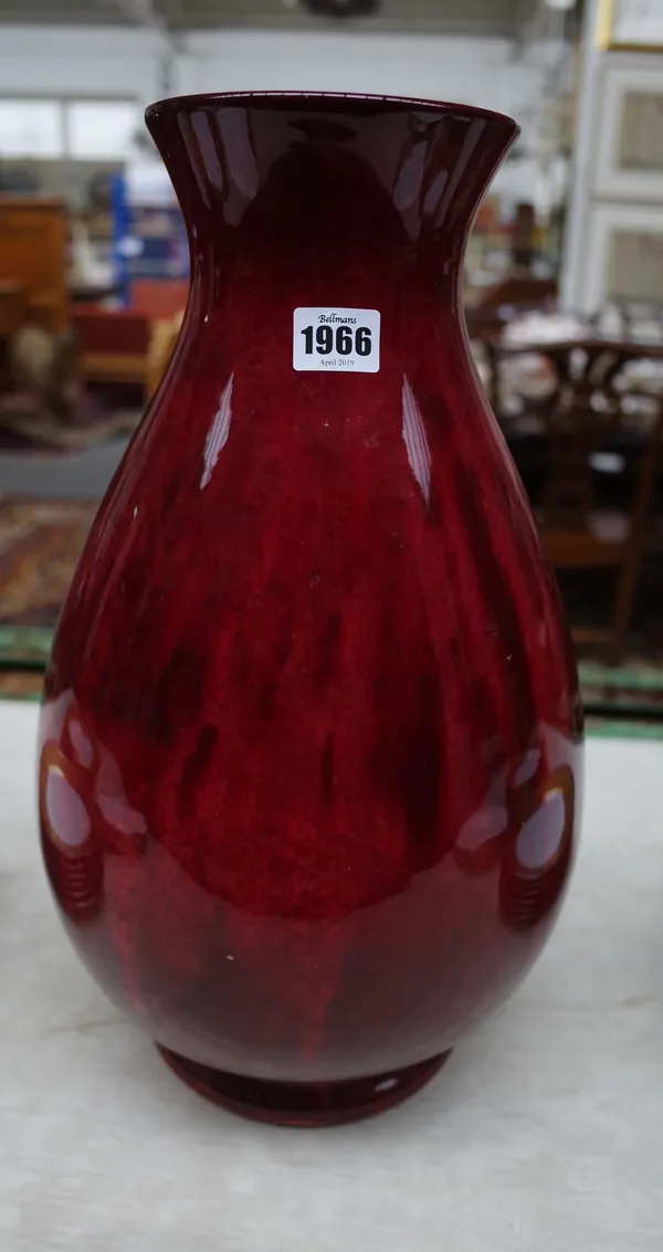 A large Moorcroft flambé vase, dated 1929, of baluster form, covered in a mottled deep red glaze, blue painted signature and date, impressed Moorcroft