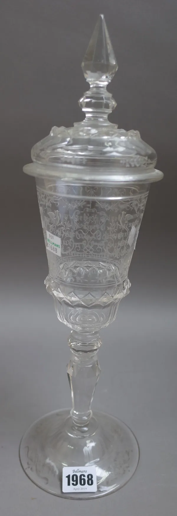 A Fachschule Haida, Austria, tall engraved commemorative glass goblet and cover, late 19th/early 20th  century, the flared bowl finely engraved on one