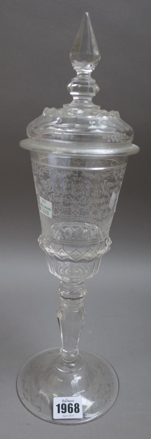 A Fachschule Haida, Austria, tall engraved commemorative glass goblet and cover, late 19th/early 20th  century, the flared bowl finely engraved on one