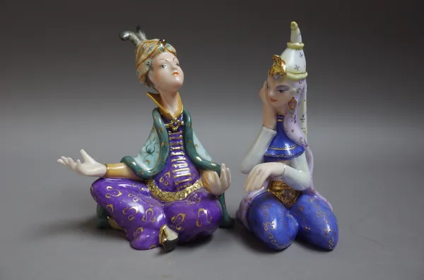 Two Herend porcelain figures depicting, comprising; 'Domonkos Larolta', dressed in a Persian dancing costume, No. 15196, 12.5cm high and 'Bognar Zoolt