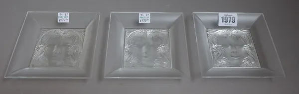 Three modern Lalique square dishes, each relief moulded to the centre with a siren portrait with a mythological fish border, etched 'Lalique France',