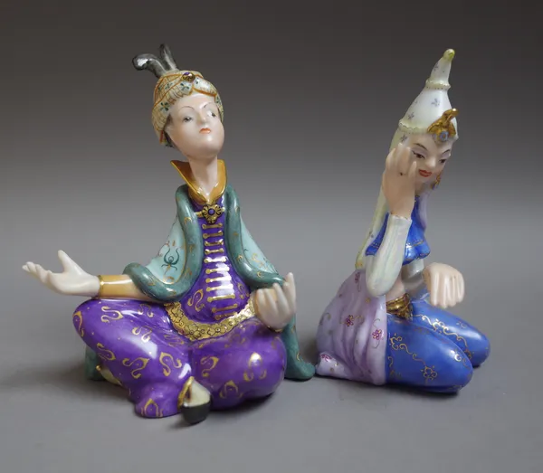 Two Herend porcelain figures depicting, comprising; 'Domonkos Larolta', dressed in a Persian dancing costume, No. 15196, 12.5cm high and 'Bognar Zoolt