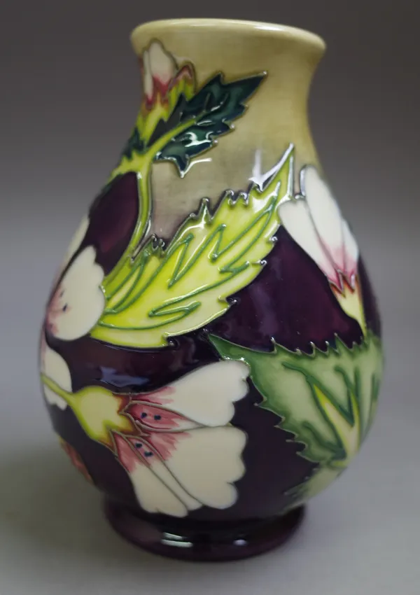 A Moorcroft vase, 'Mallow', from the herb collection, circa. 1999, designed by Philip Gibson, 13.5cm high.