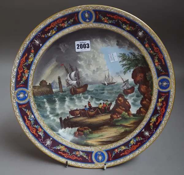 A `Vienna' porcelain circular dish, late 19th/early 20th century, painted with ships at sea in stormy conditions, inside a brown border painted with u