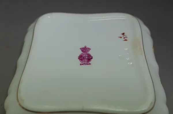 A Mintons bone china miniature tea service, each piece painted with flowers inside gilt dentil rims, comprising; a tray, teapot and cover, sugar bowl