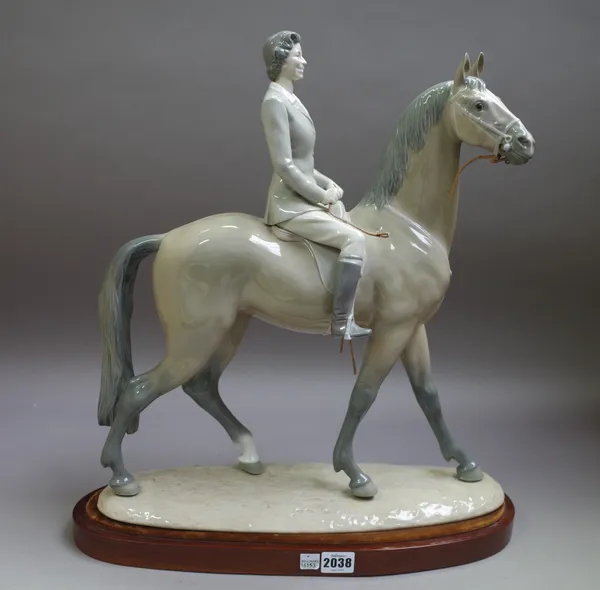 A Lladro porcelain figure of Her Majesty The Queen on horseback Ltd Edition No 43 of 100, available in Great Britian, with certificate and wooden stan